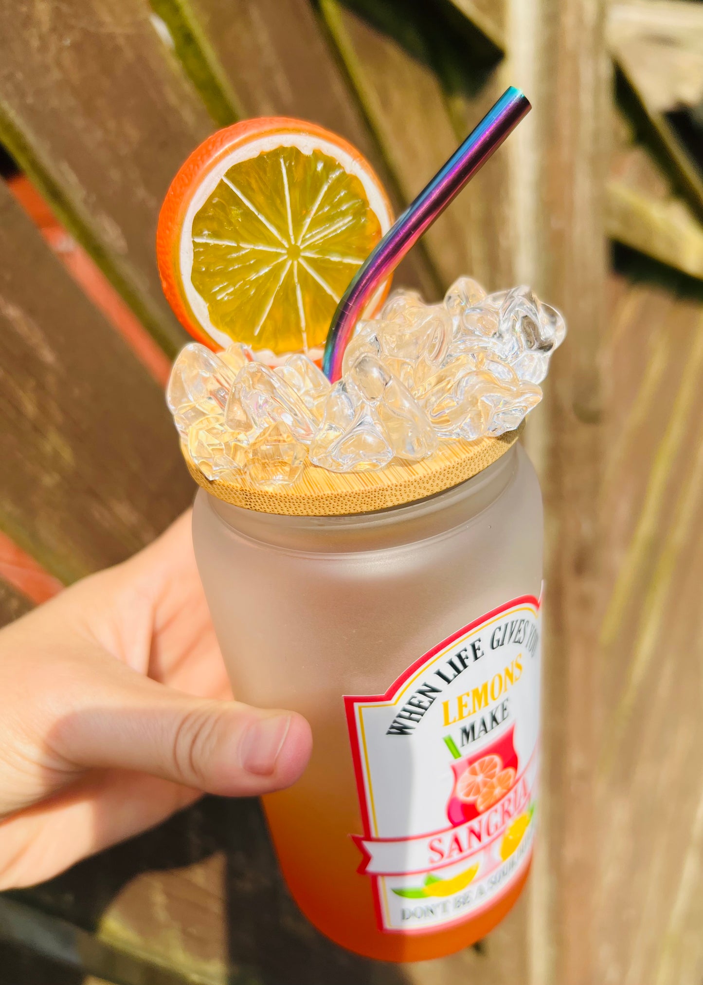 16oz ombré orange frosted glass with sangria decal witch ice and a slice lid