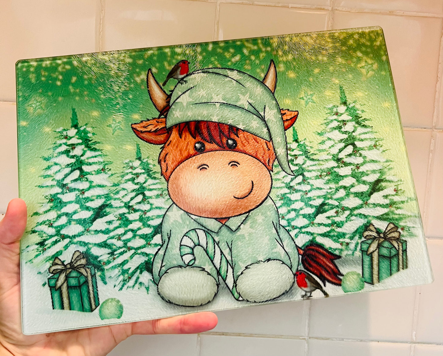 Highland cow (sage green Christmas) glass cutting board